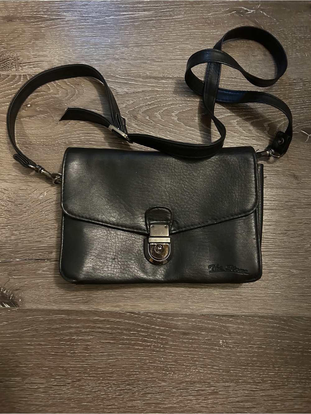 Black Leather Crossbody Bag with Lock Closure by The Stone